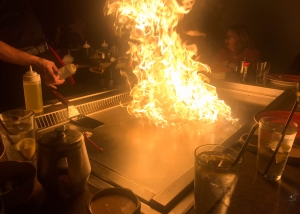 Hibachi grill with rising flames.